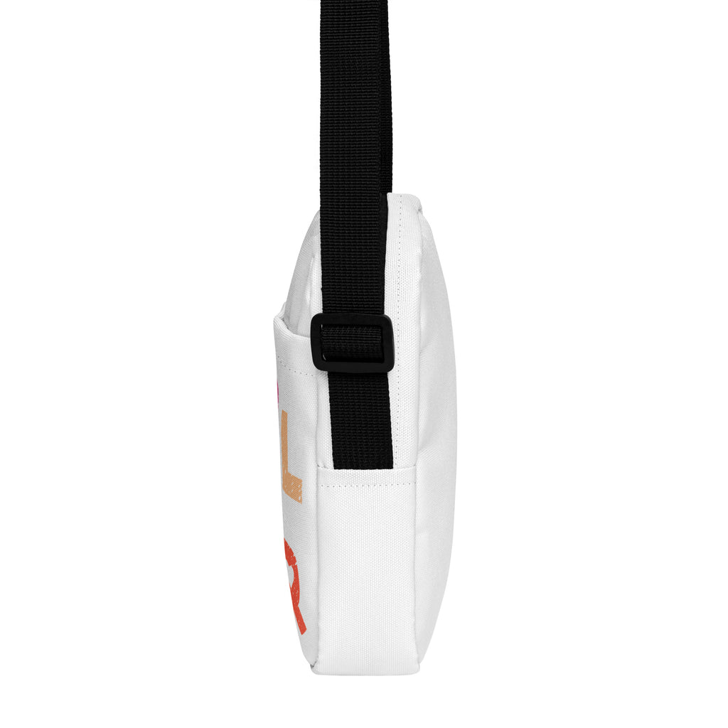 White canvas girl power kids crossbody purse with black strap and orange lettering design