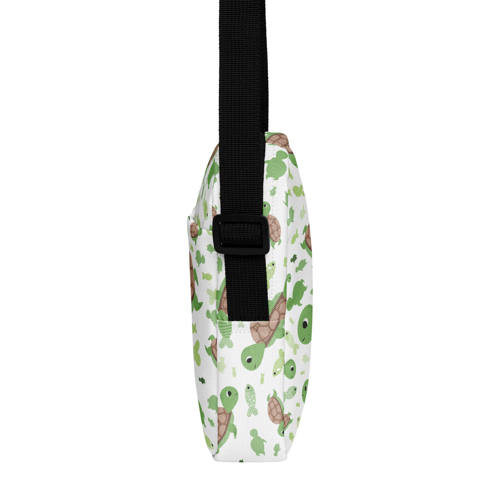 White crossbody bag with playful green and brown cartoon turtle pattern for girls sea turtle purse