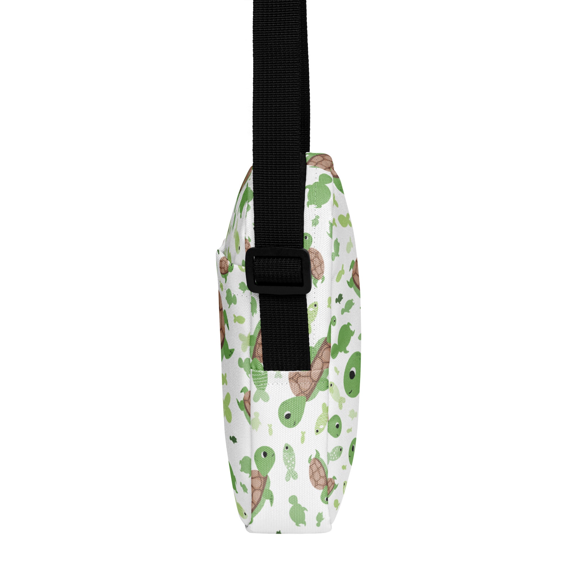 White crossbody bag with playful green and brown cartoon turtle pattern for girls sea turtle purse
