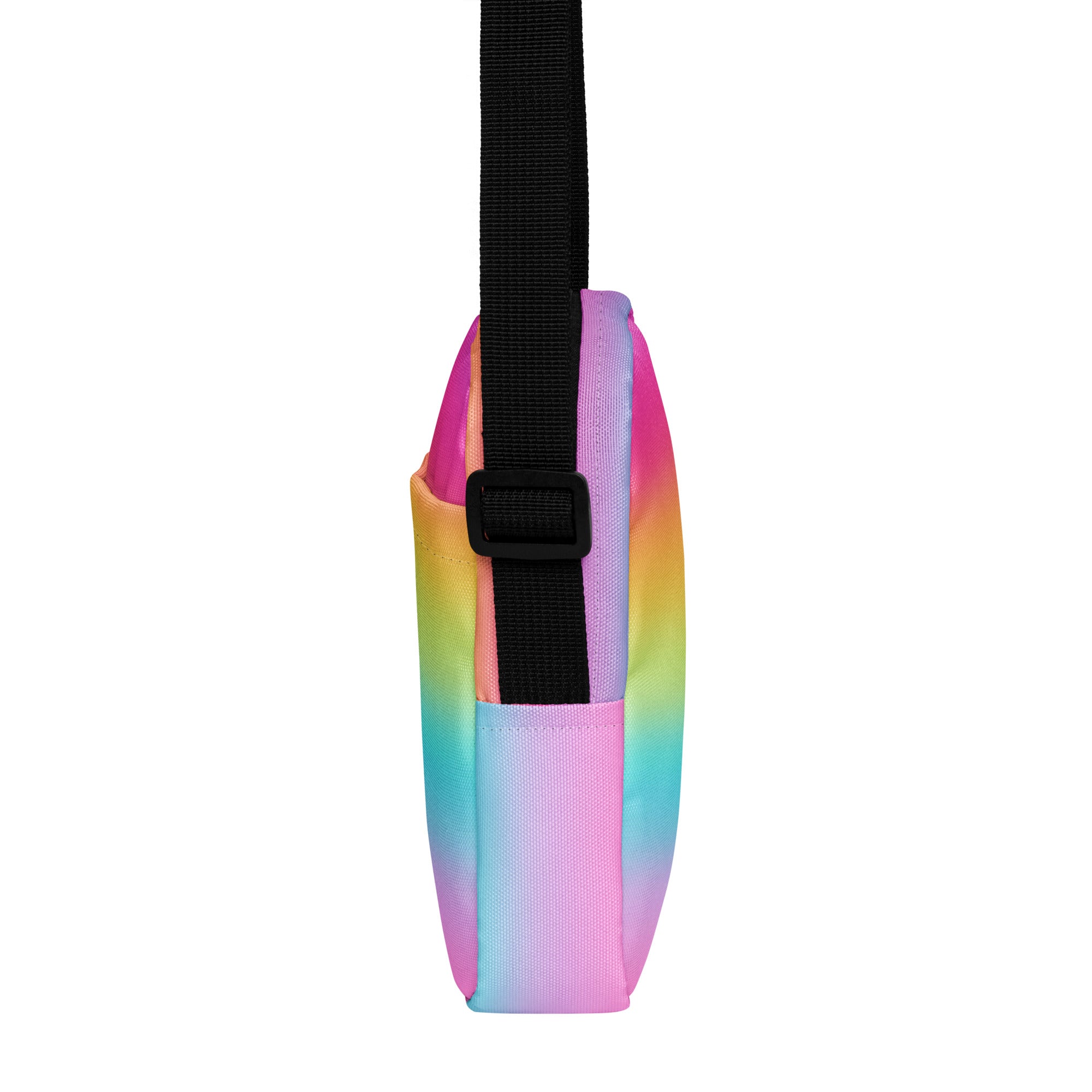 A vibrant rainbow tie-dye girls crossbody purse with a black adjustable strap and zipper closure