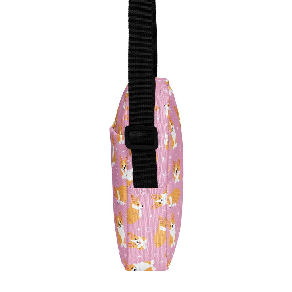 Girls pink corgi crossbody purse with a pink corgi pattern and black adjustable strap for easy carrying