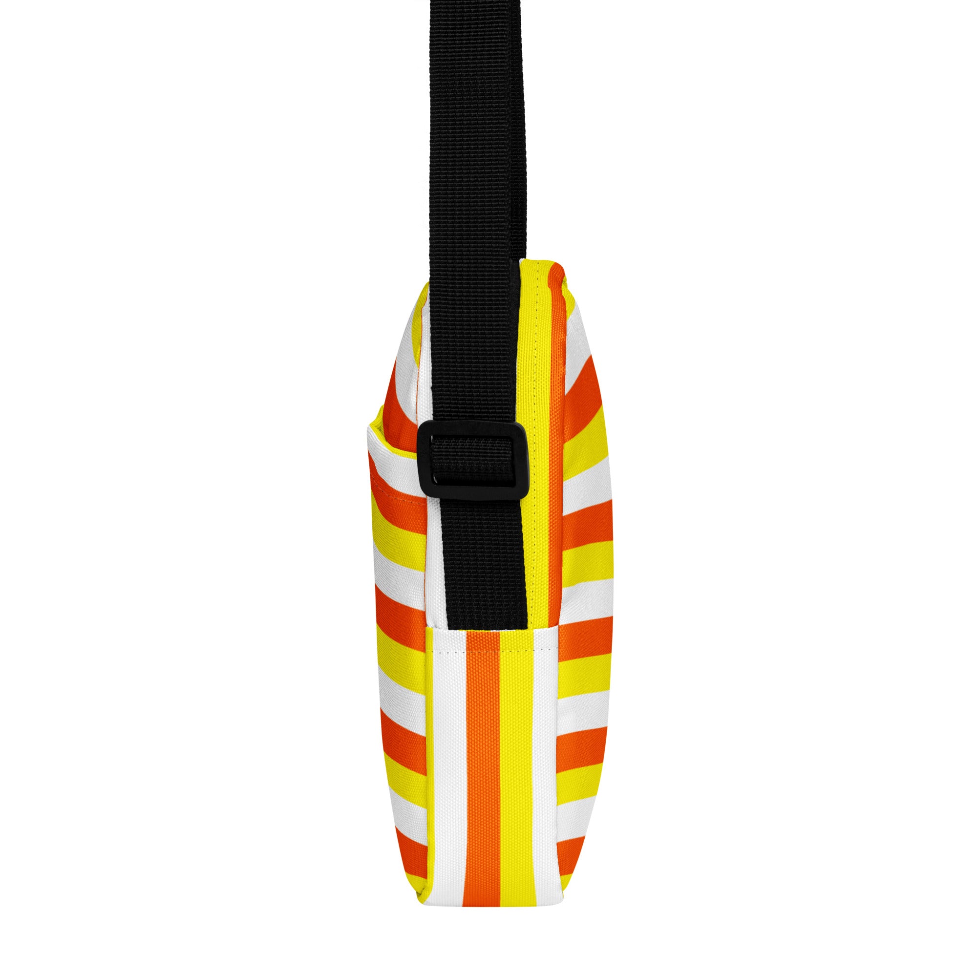 A girls candy corn stripes halloween crossbody purse with bold orange yellow and white fabric and a black adjustable strap