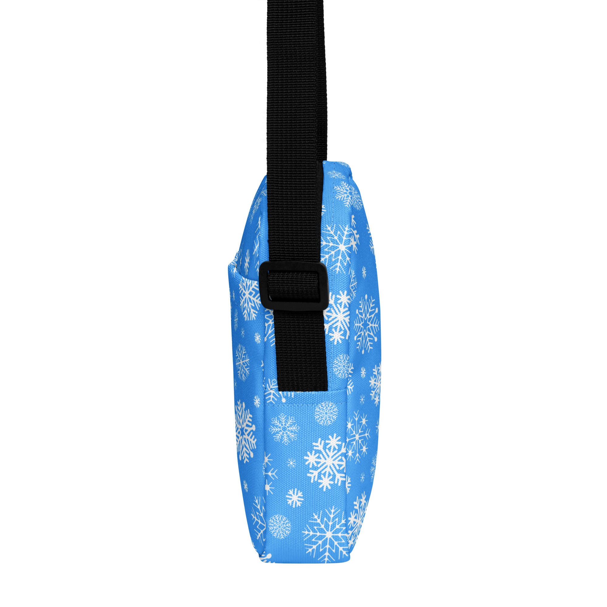 Blue snowflake winter women’s crossbody purse with adjustable black strap and snowflake pattern design