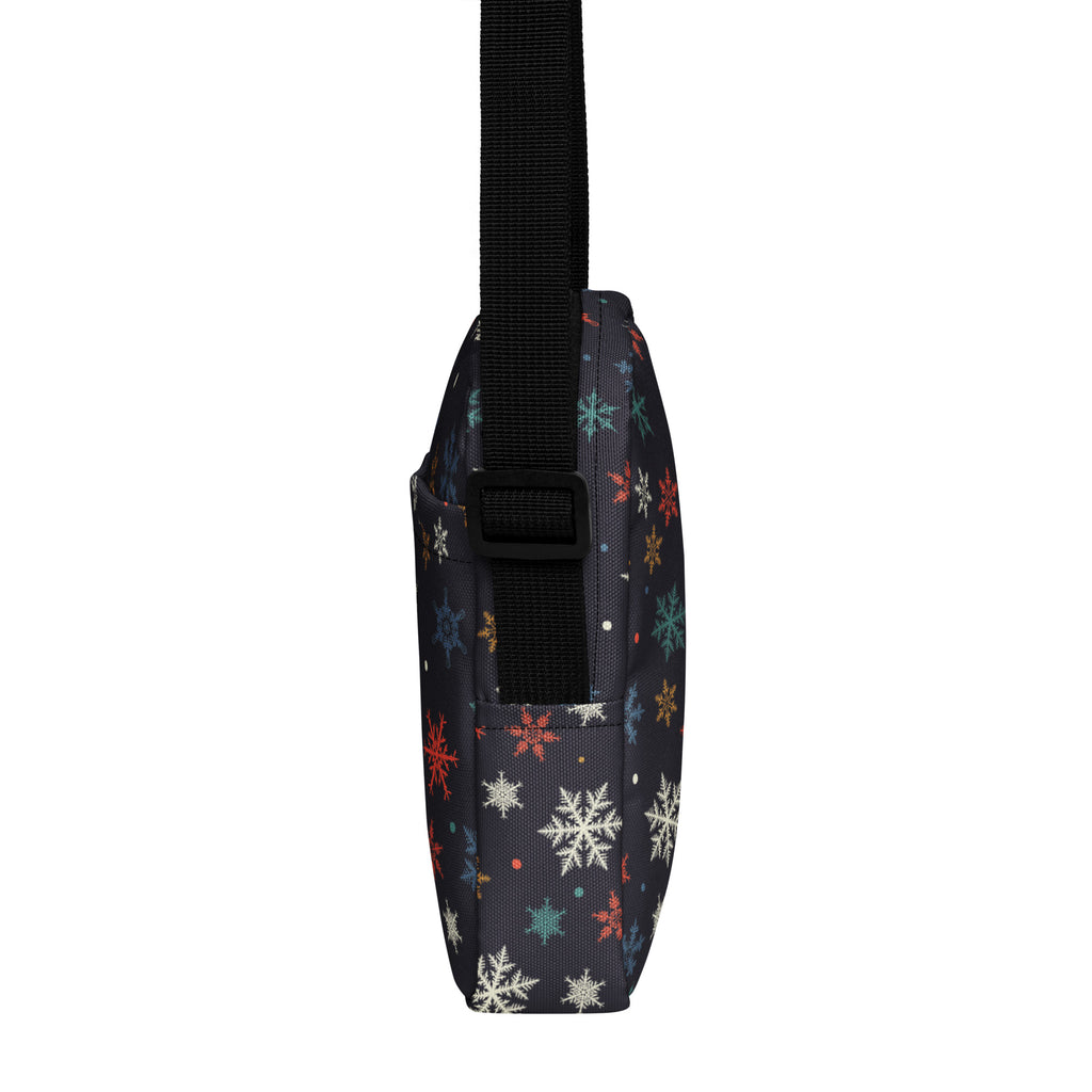 Girls colorful snowflakes crossbody purse in dark navy with multicolored snowflake pattern in white red teal and gold
