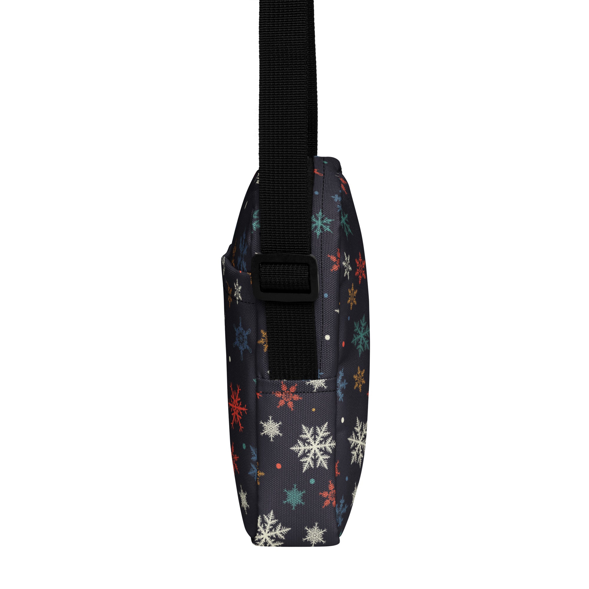 Girls colorful snowflakes crossbody purse in dark navy with multicolored snowflake pattern in white red teal and gold