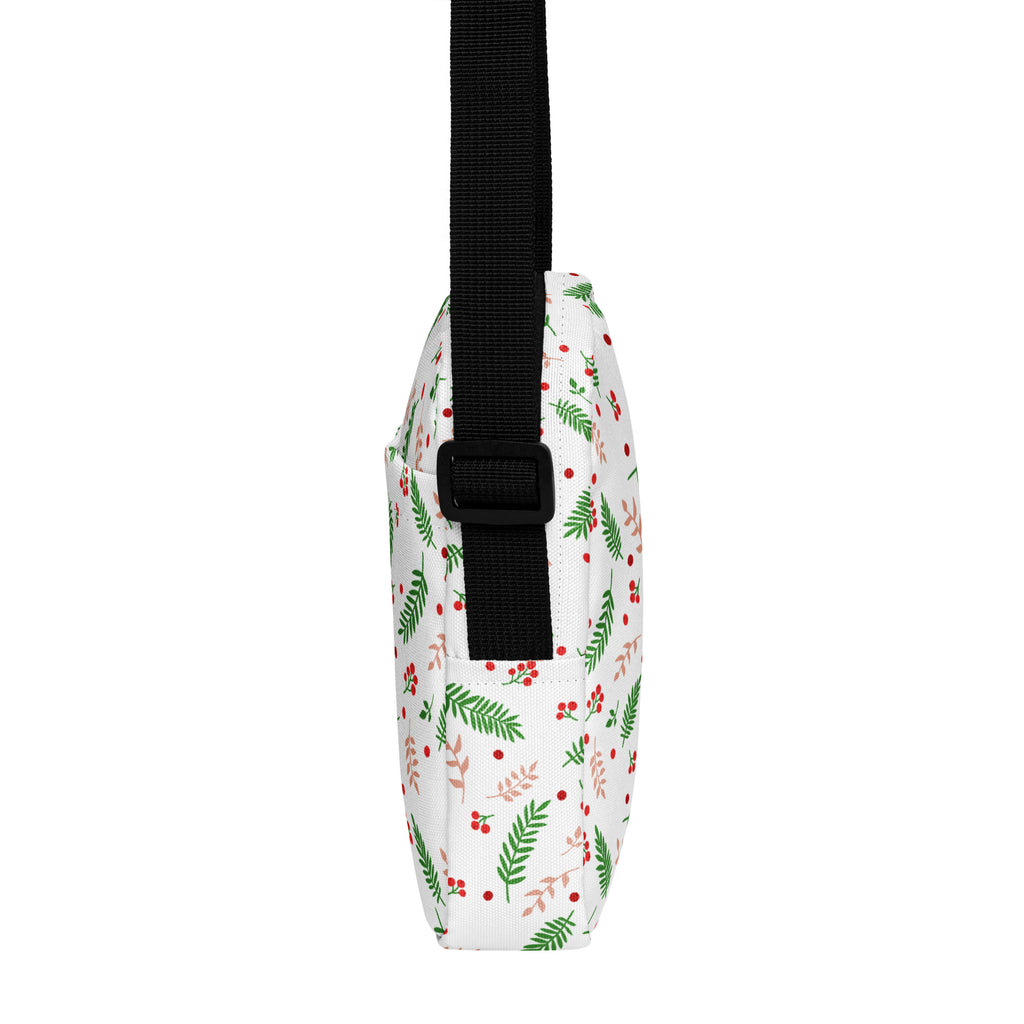White winter fern and berry women’s crossbody purse with festive green fern and red berry pattern on white fabric