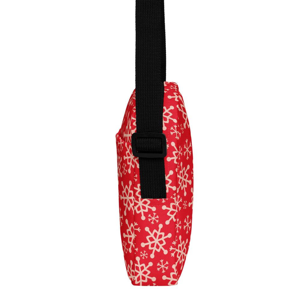 Girls red crossbody purse with white snowflake pattern and black adjustable strap for winter use