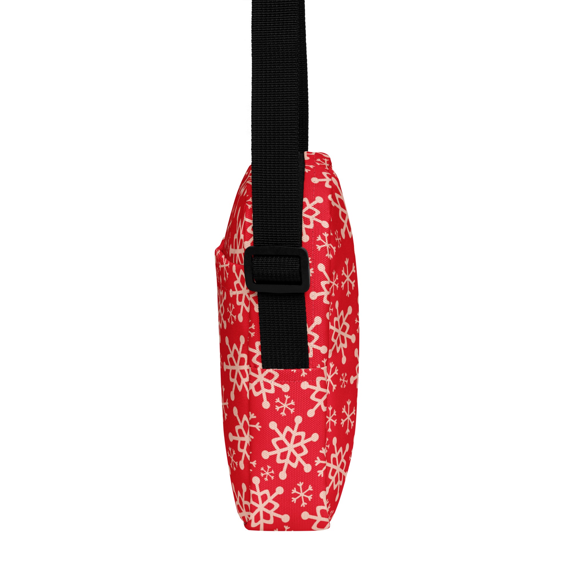 Red snowflake christmas women’s crossbody purse in red with white snowflake pattern and black adjustable strap
