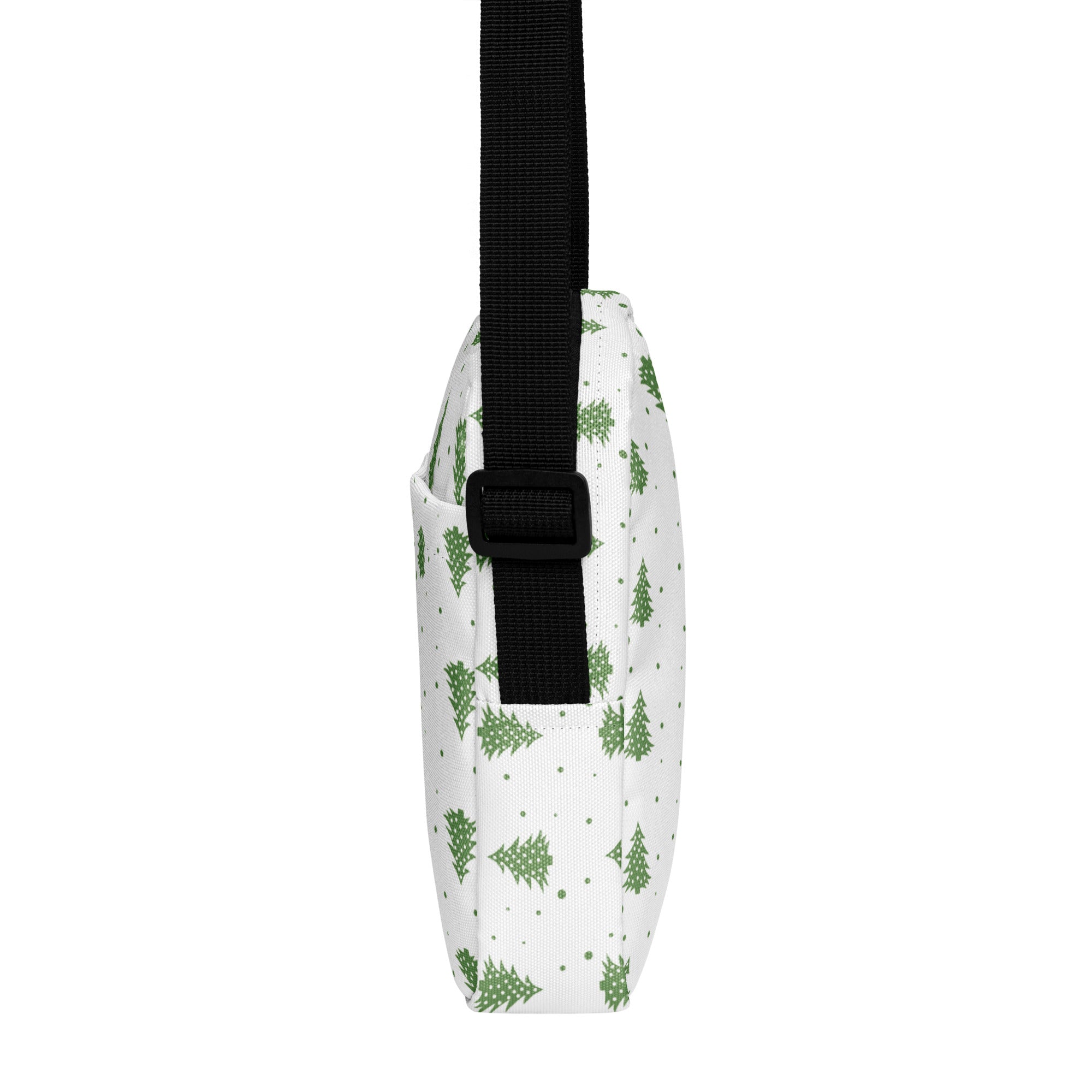 White girls crossbody purse with green pine tree pattern and black adjustable strap for christmas use