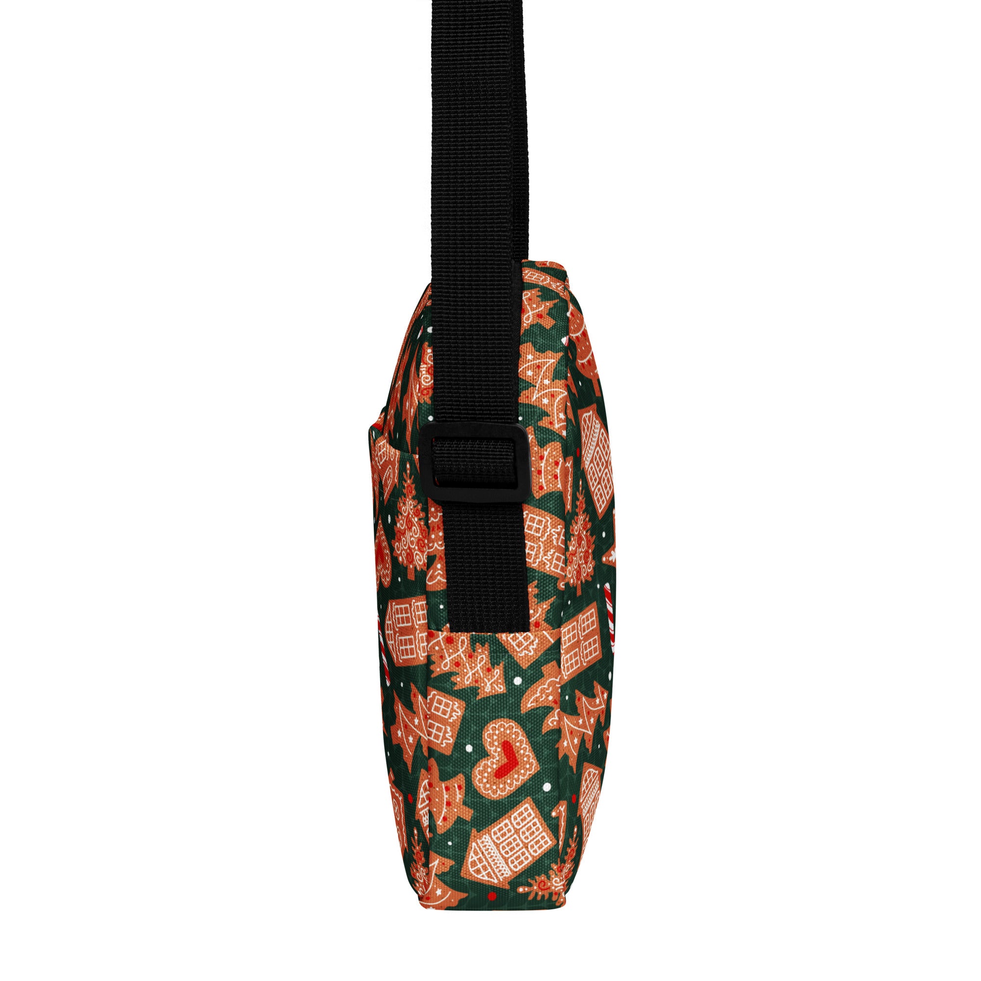 Green gingerbread christmas women’s crossbody purse with dark green fabric featuring orange gingerbread house and candy cane patterns