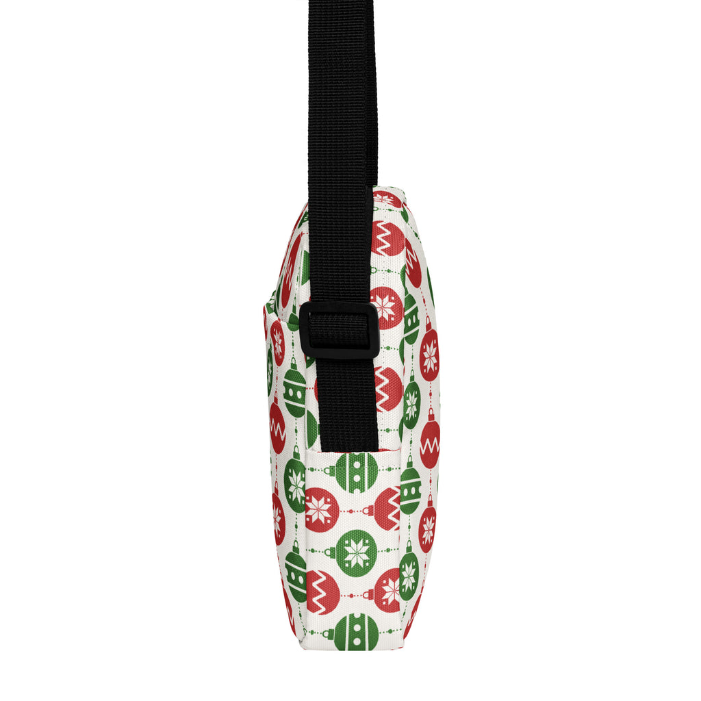 White crossbody bag with red and green christmas ornament pattern and black adjustable strap for girls
