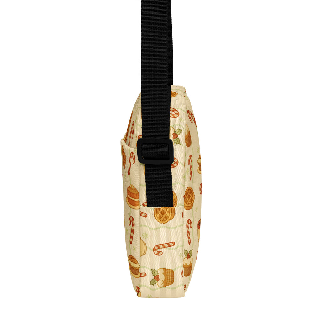 Cream-colored crossbody bag with playful holiday candy cane pie and cupcake pattern in warm tones for women