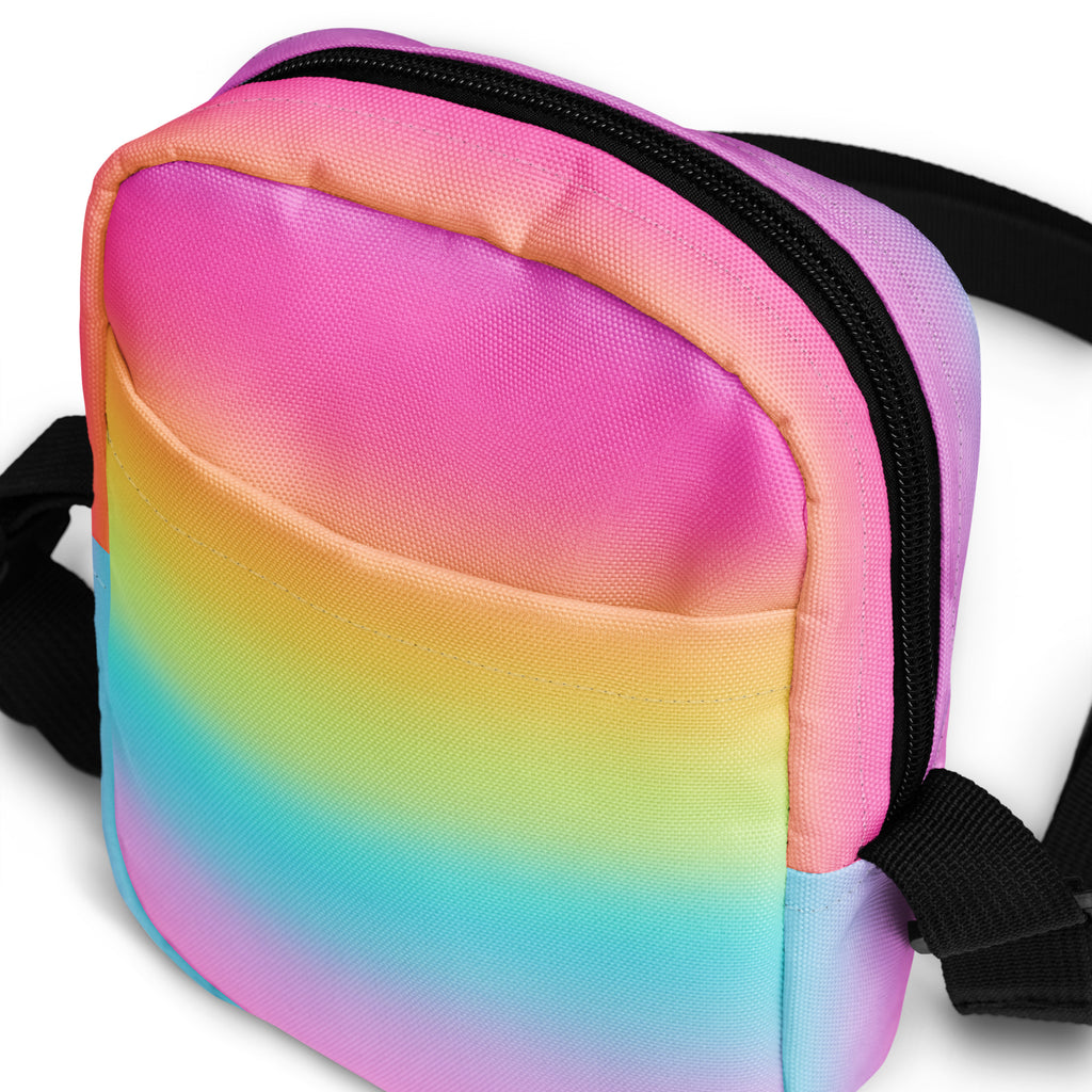 Girls bright rainbow crossbody purse made of gradient fabric with black zipper and adjustable straps for everyday use