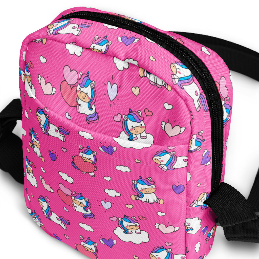 Girls pink unicorn crossbody purse with black zipper and straps made of soft material for everyday use
