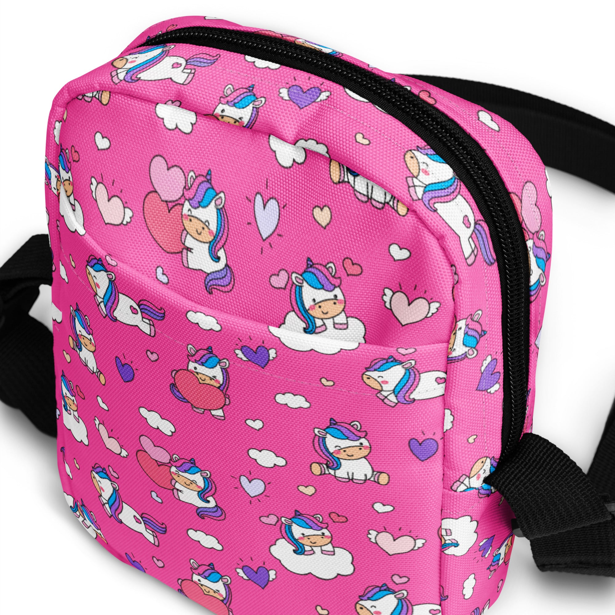 Girls pink unicorn crossbody purse with black zipper and straps made of soft material for everyday use