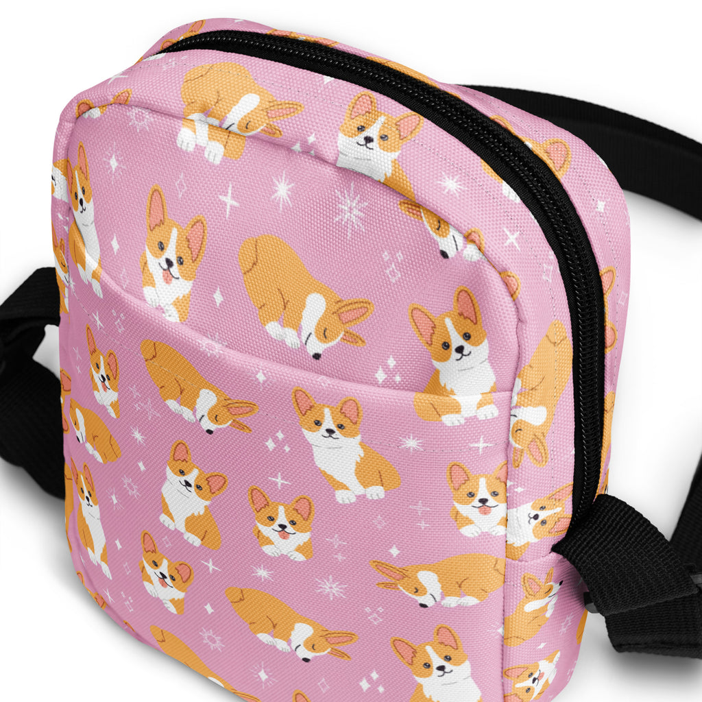 Girls pink corgi crossbody purse with black zipper and straps featuring corgi pattern design