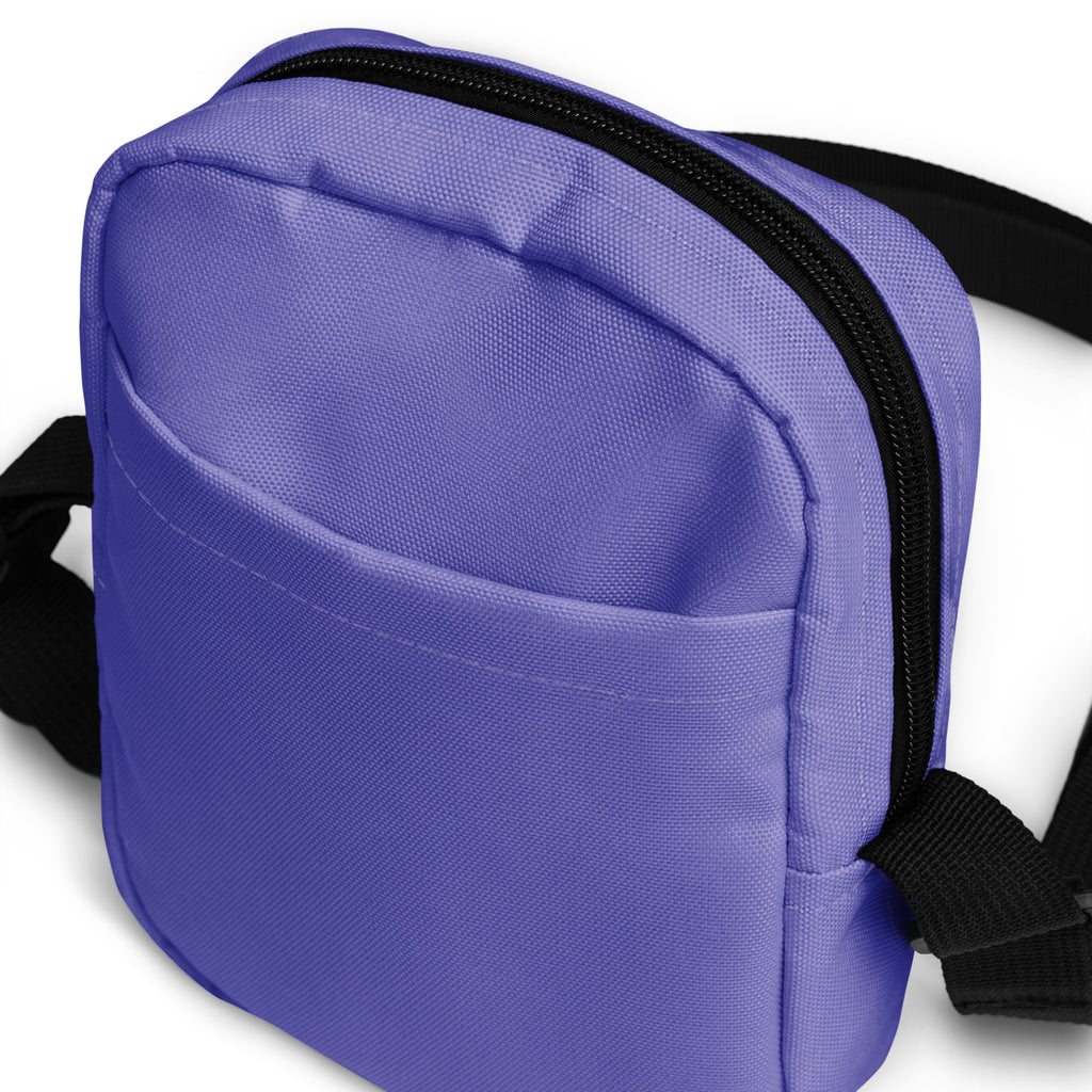 Girls purple crossbody purse made of canvas with a black zipper and adjustable strap for easy carrying