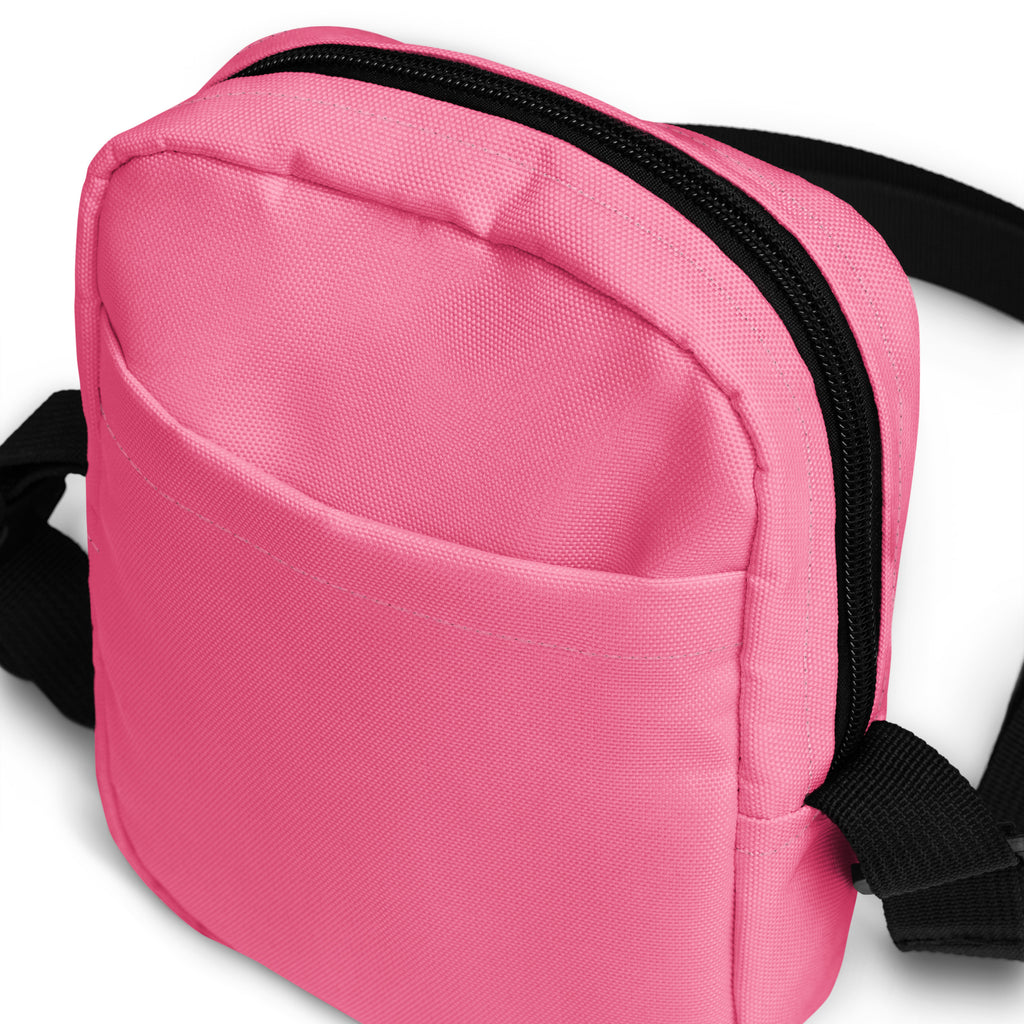 Girls pink crossbody purse in canvas with black zipper and adjustable strap for hands-free use