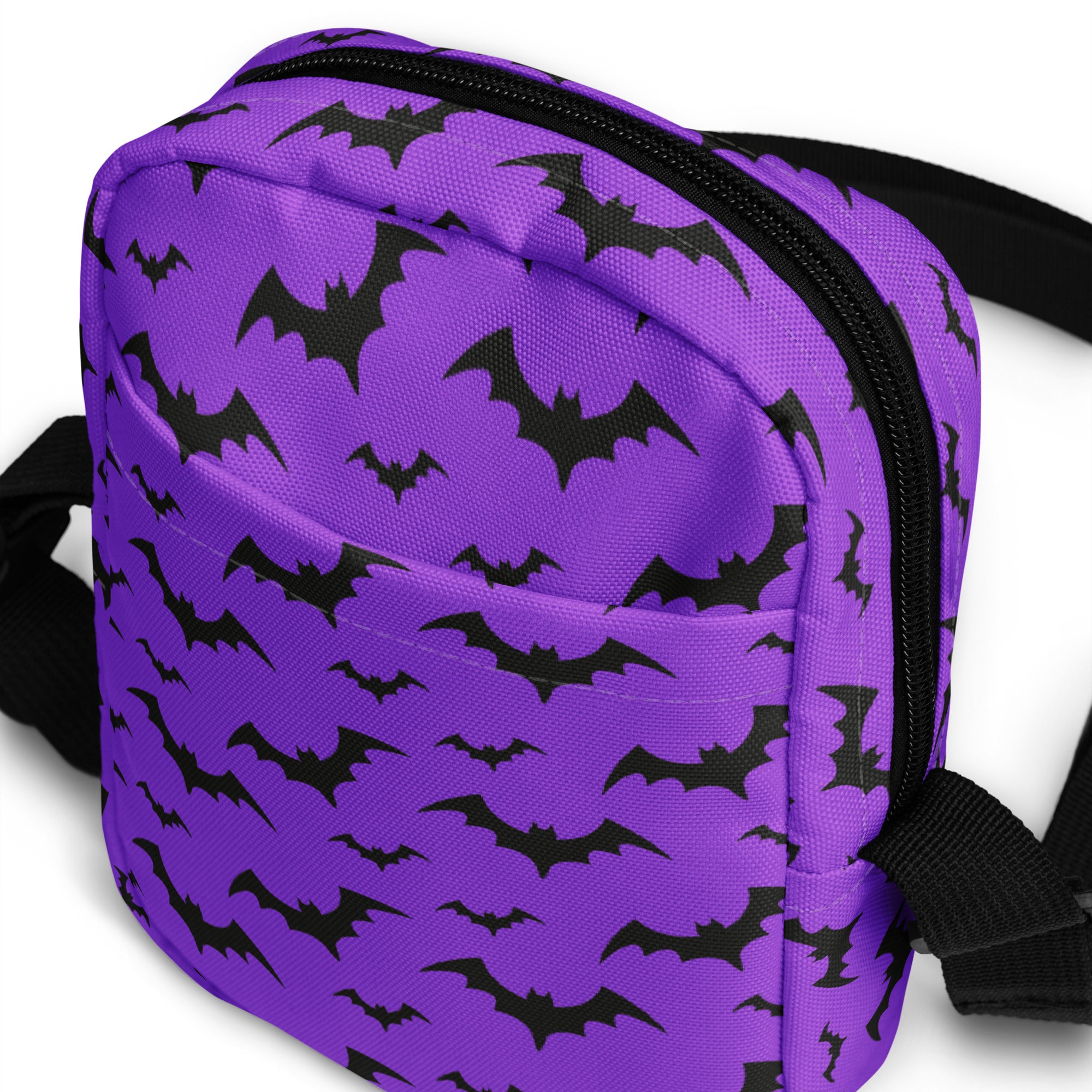 Kids purple bats Halloween crossbody purse with bat pattern, black zipper, and adjustable straps for easy carrying