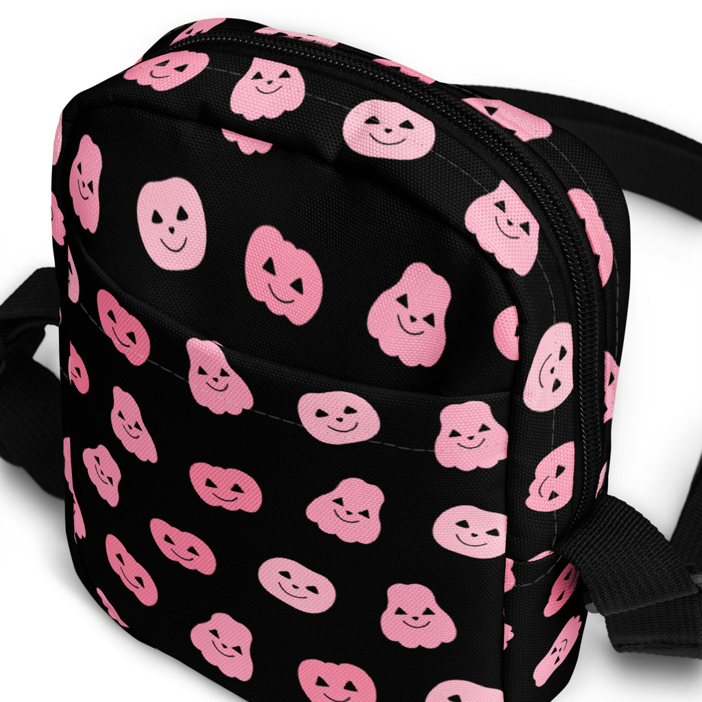 Black crossbody bag with pink smiling pumpkin faces printed for girls pink pumpkins halloween crossbody purse