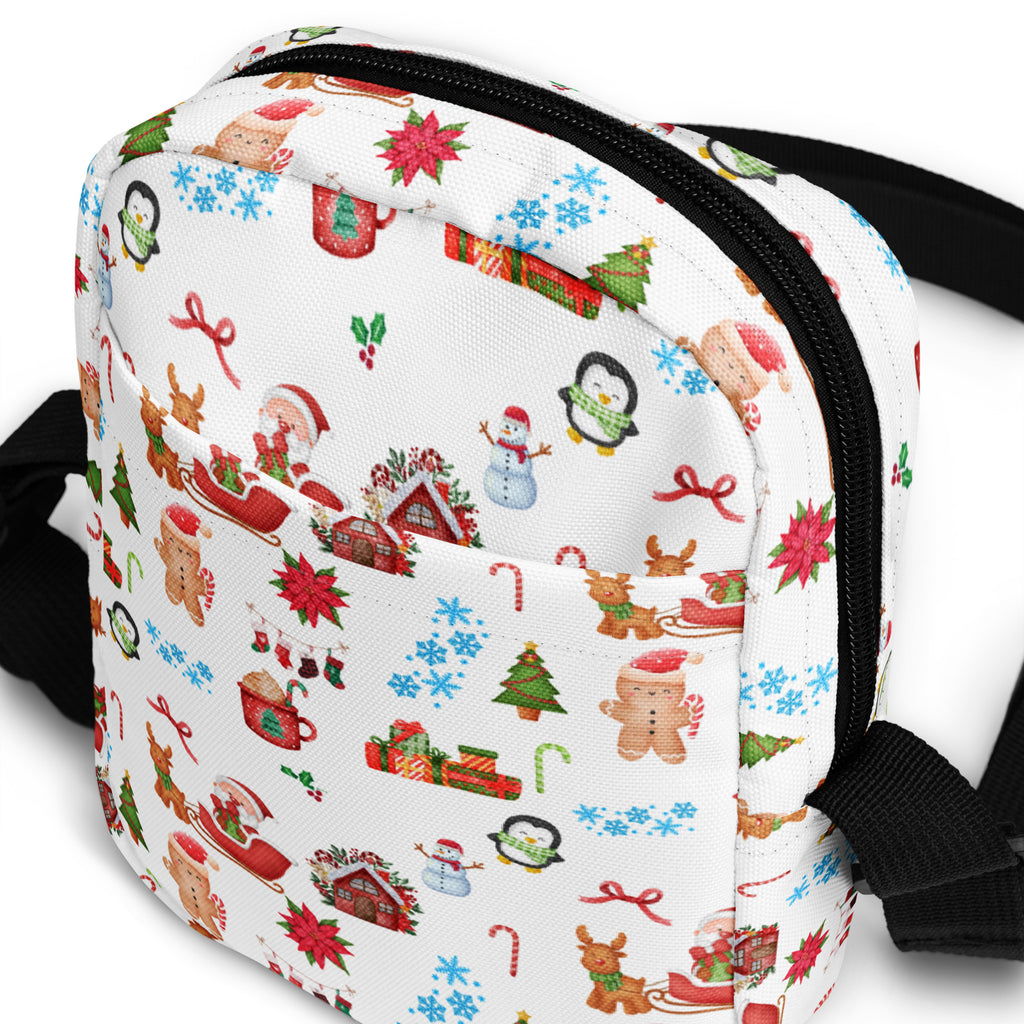 White girls Christmas crossbody purse with festive penguin snowman reindeer and gingerbread men fabric illustrations