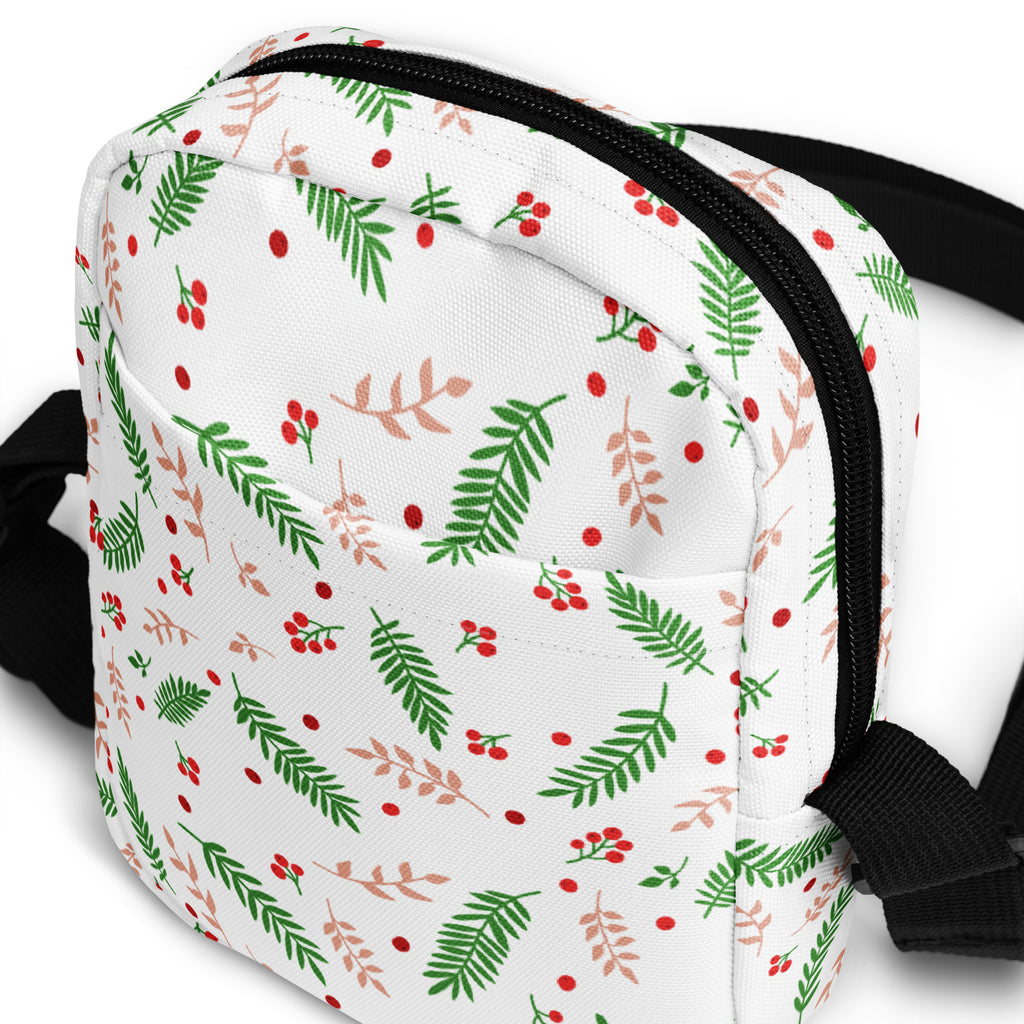 Girls winter greenery and red berries white crossbody bag with festive leaf pattern black zipper and adjustable strap