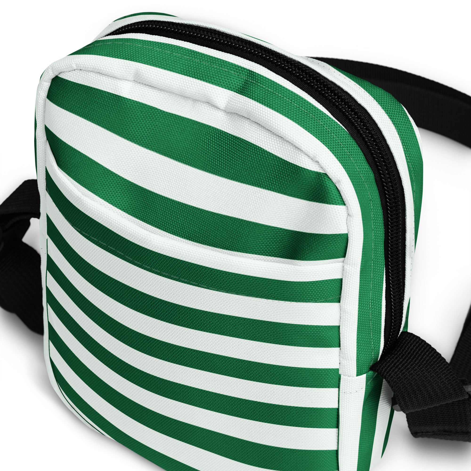 Green and white candy stripe canvas crossbody purse with black zipper and straps for christmas use