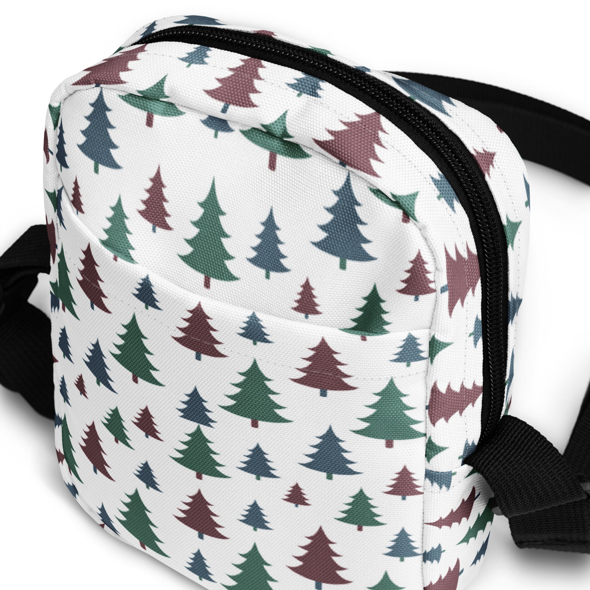 White canvas crossbody bag with playful green blue and maroon pastel Christmas tree pattern for girls
