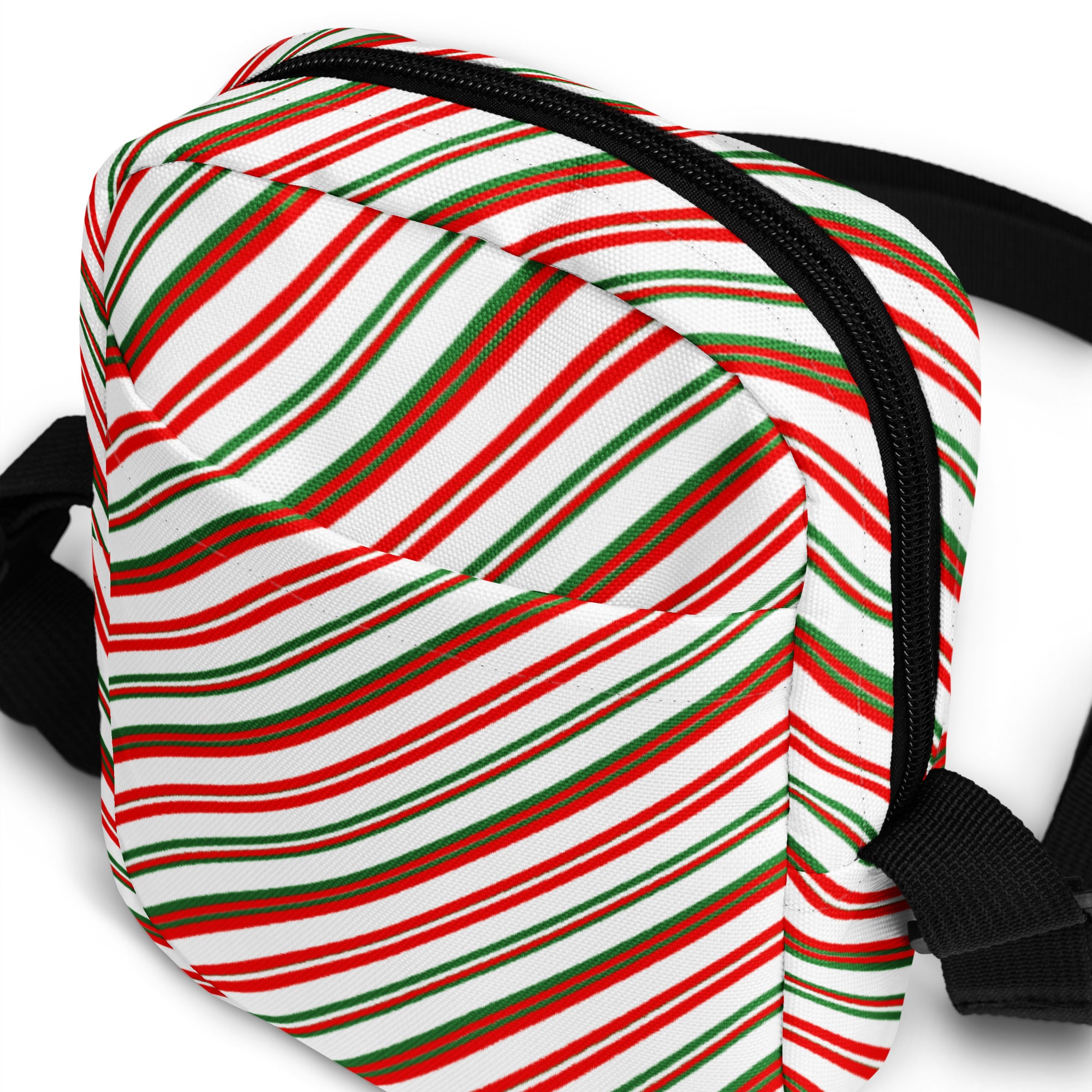Girls Christmas stripes crossbody purse with festive red green and white candy cane fabric and black zipper and straps