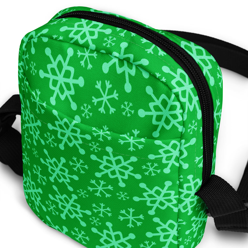 Green snowflake patterned crossbody purse with black zipper and straps for women holiday use
