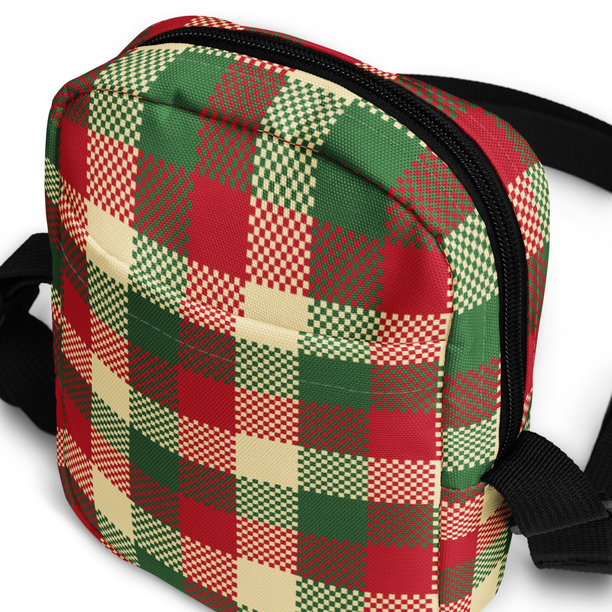 A festive red green and cream plaid winter women crossbody purse with black zipper and adjustable strap