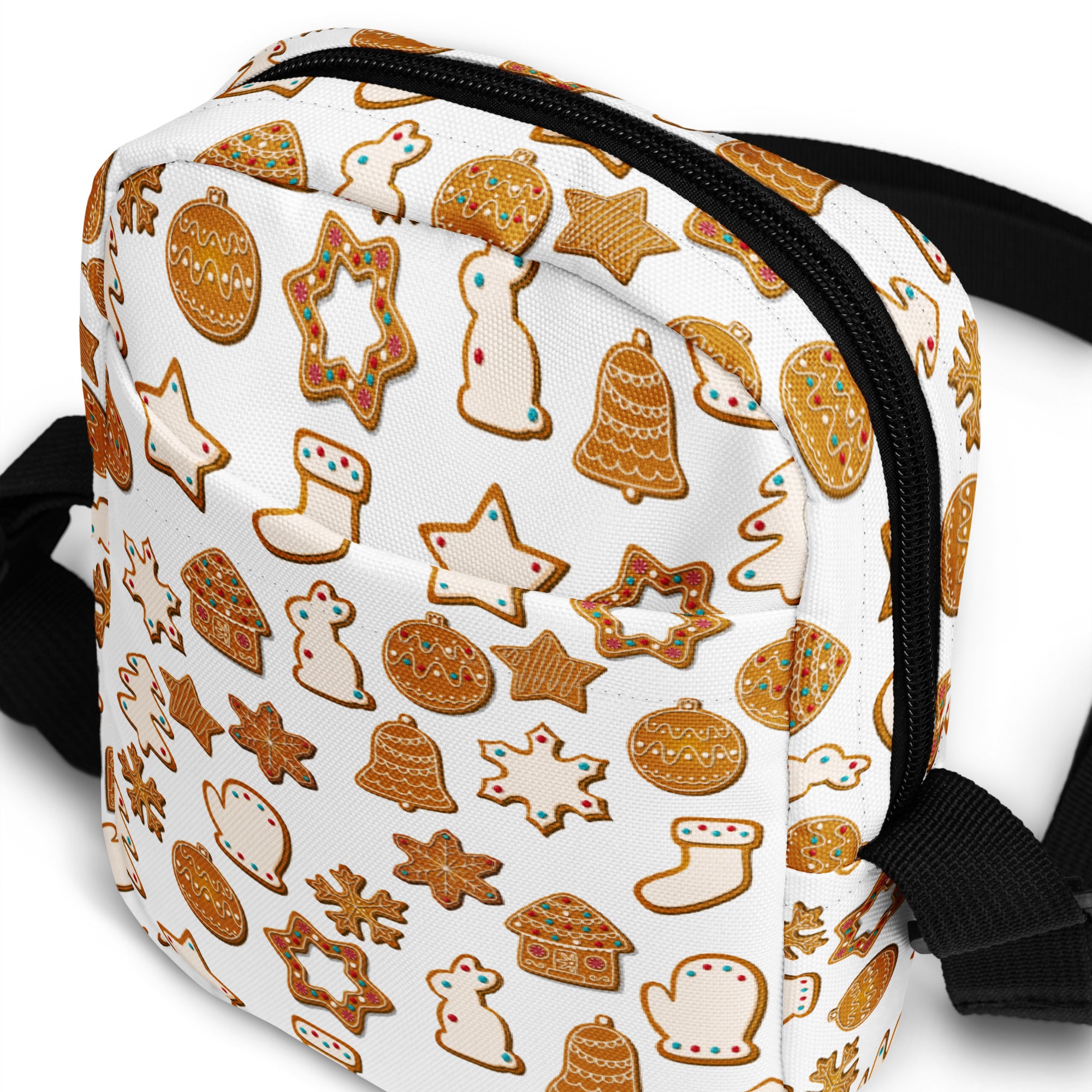 White crossbody bag with gold gingerbread cookie pattern and festive red and green accents for christmas use