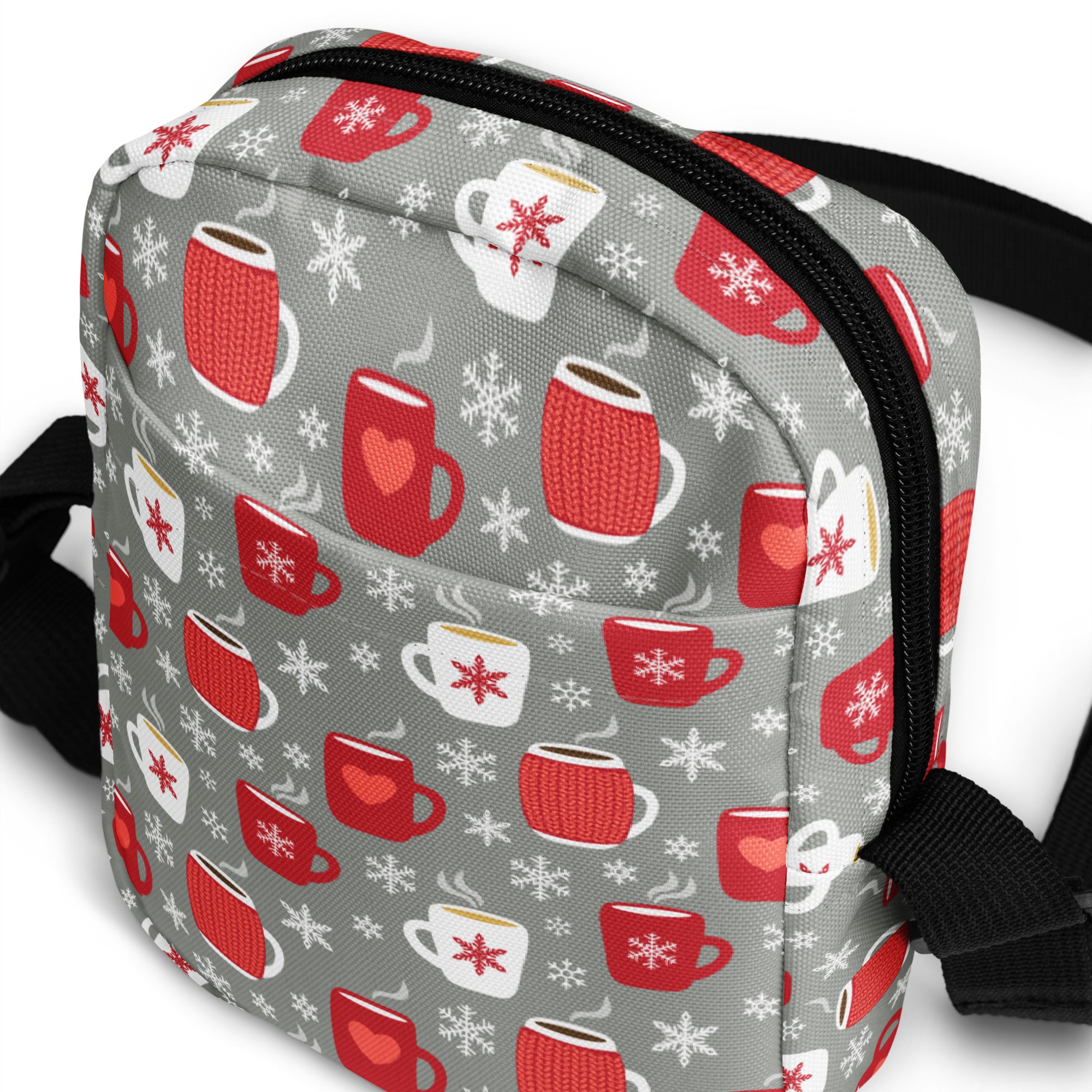 Gray crossbody bag with festive red and white knit mugs and snowflakes pattern for cozy winter use