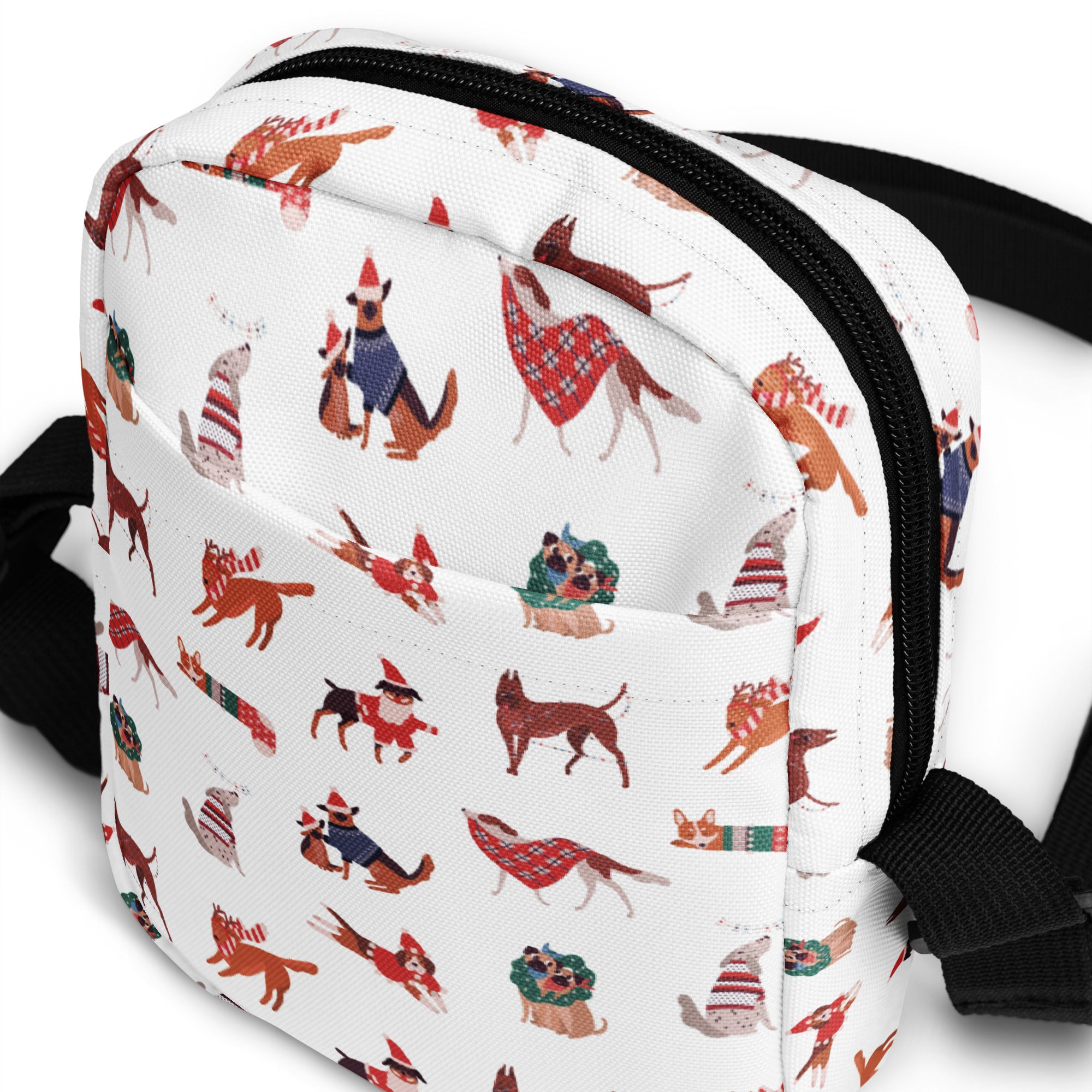 White crossbody bag with festive cartoon dogs wearing holiday scarves hats and sweaters for girls Christmas use