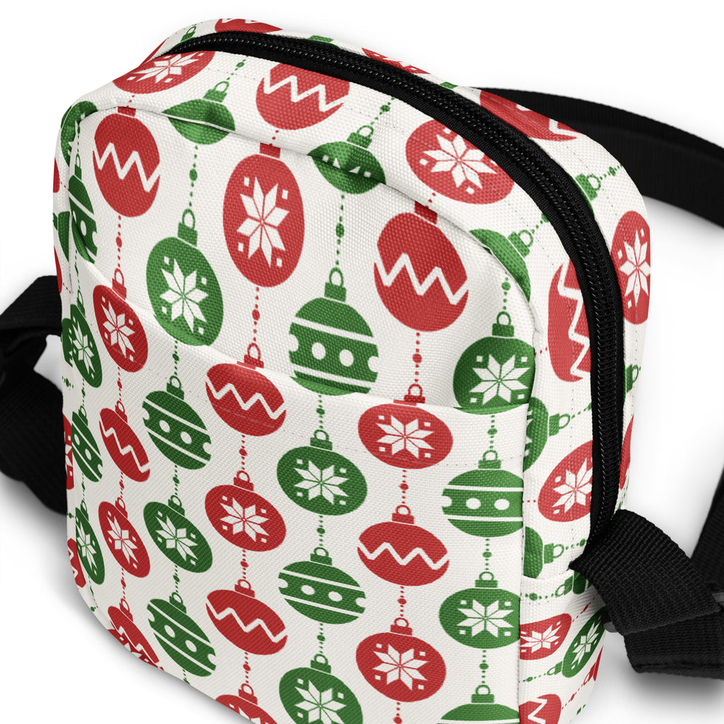 A festive white crossbody purse with red and green Christmas ornament patterns for girls holiday use