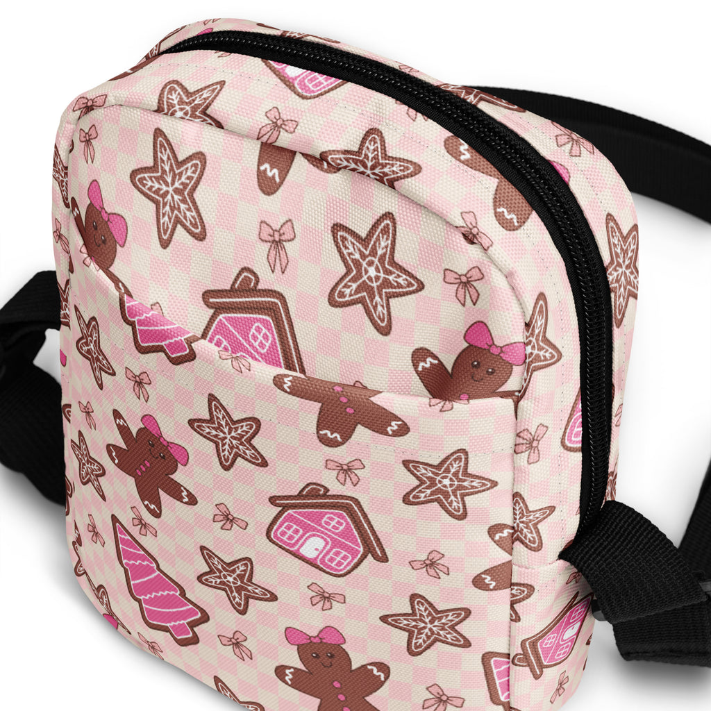 Girls pink gingerbread christmas crossbody purse with brown checkered gingerbread-themed pattern