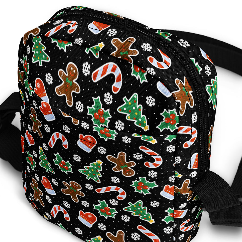 Girls gingerbread candy cane Christmas crossbody purse in black with festive gingerbread men candy cane and holly patterns