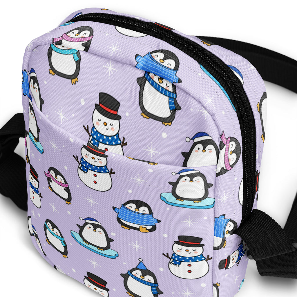 Girls winter penguin crossbody purse with lavender penguin and snowman pattern black zipper and straps