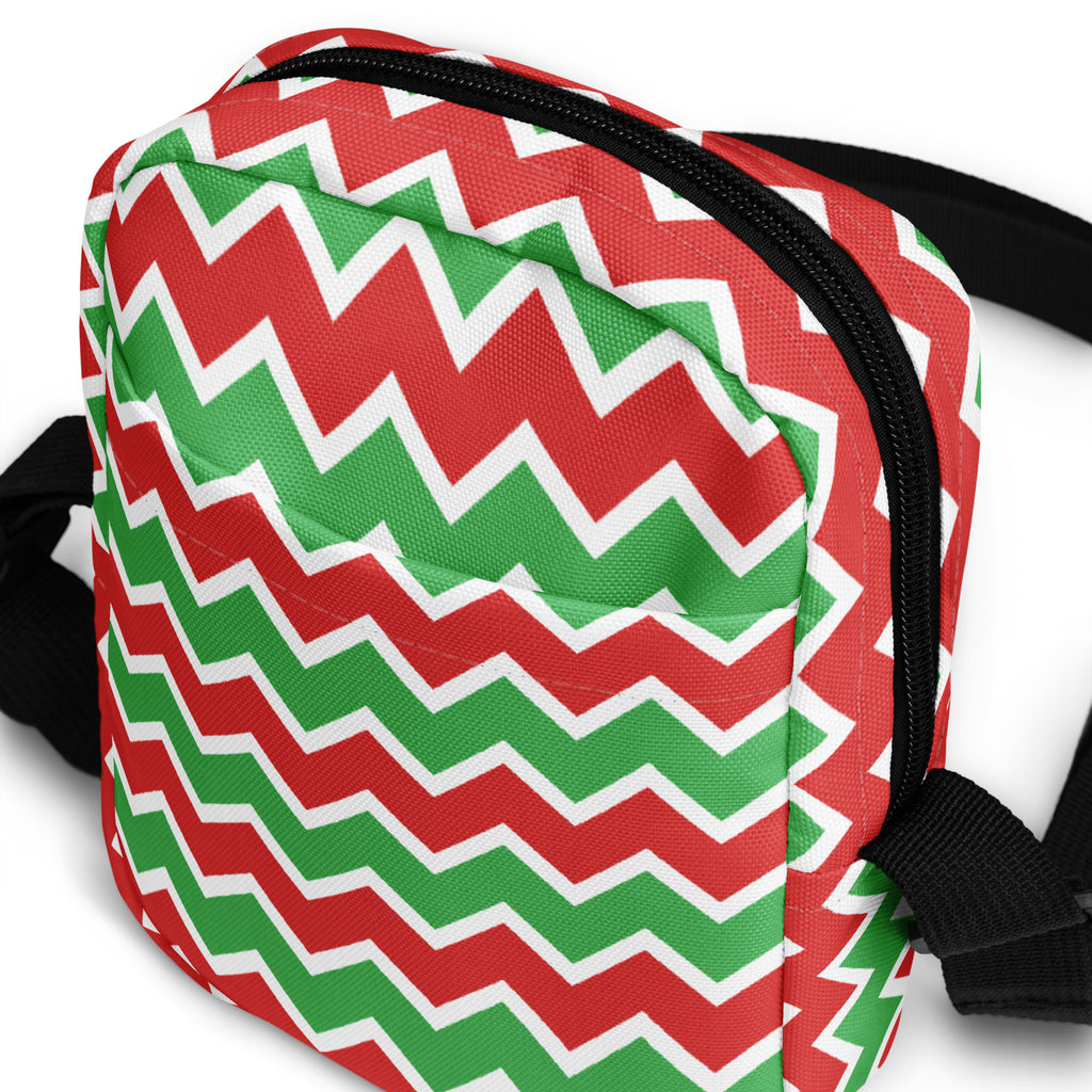 Girls red and green chevron crossbody purse with festive zigzag-patterned fabric black zipper and straps