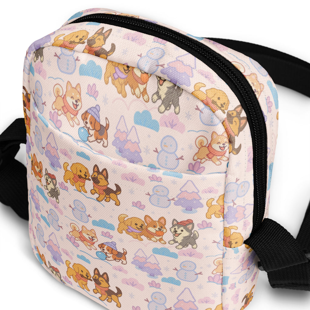 A pastel-colored girls winter dog crossbody purse with playful cartoon dogs snowmen and winter scenery pattern