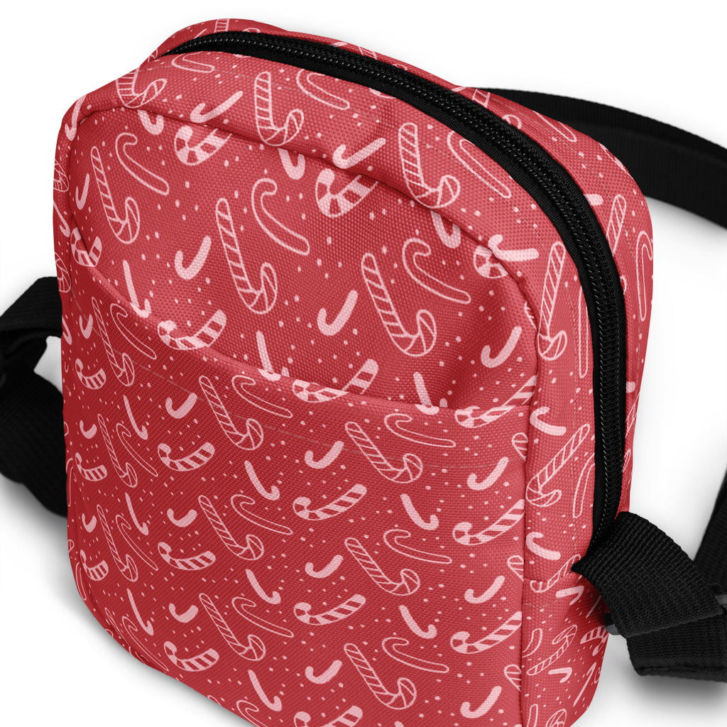 Red candy cane patterned crossbody purse with black zipper and straps perfect for Christmas use
