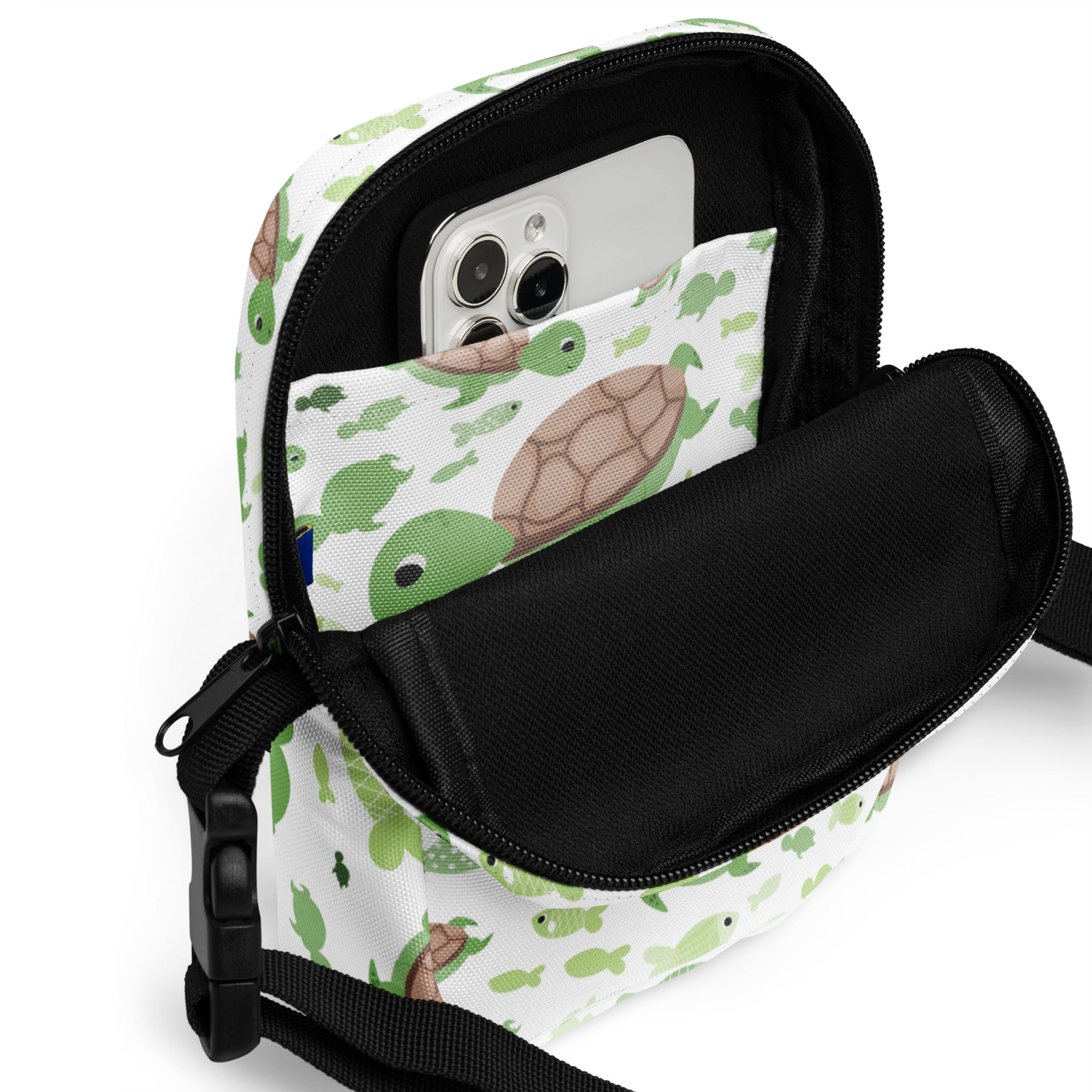 Girls green sea turtle crossbody purse with playful turtle pattern, black zipper accents, and adjustable strap