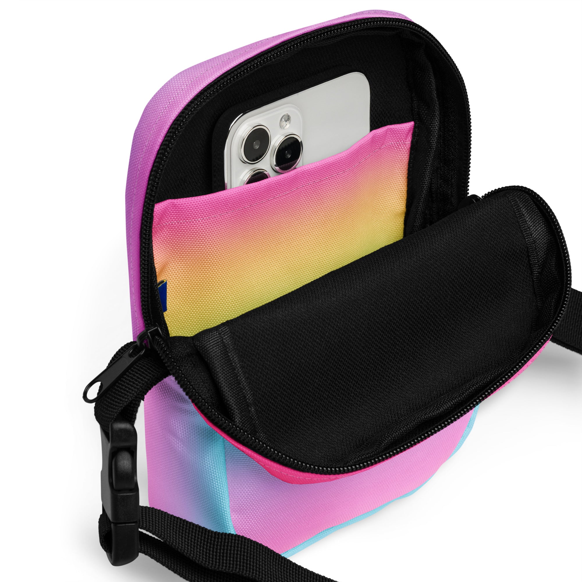 Girls bright rainbow crossbody purse with vibrant pink yellow and blue gradient and black zipper and strap