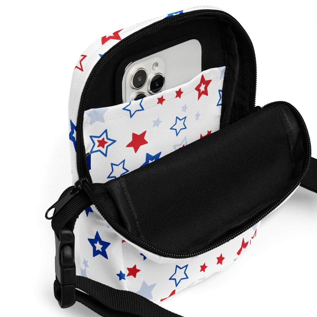Girls red white and blue stars crossbody purse with white star-patterned pouch, black zipper, and adjustable strap