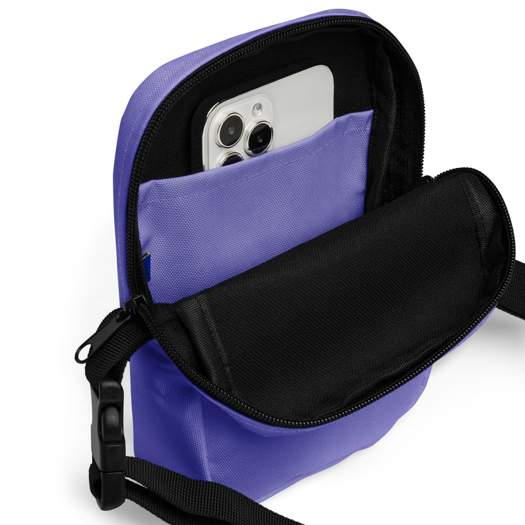Girls purple crossbody purse made of fabric with black zipper and adjustable strap for everyday use