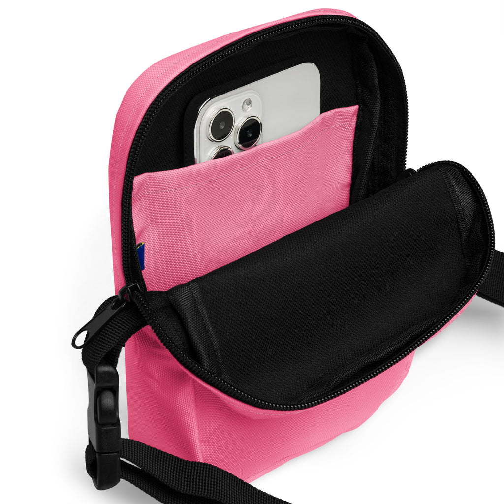 Girls pink crossbody purse made of canvas with black zipper and adjustable strap for easy carrying