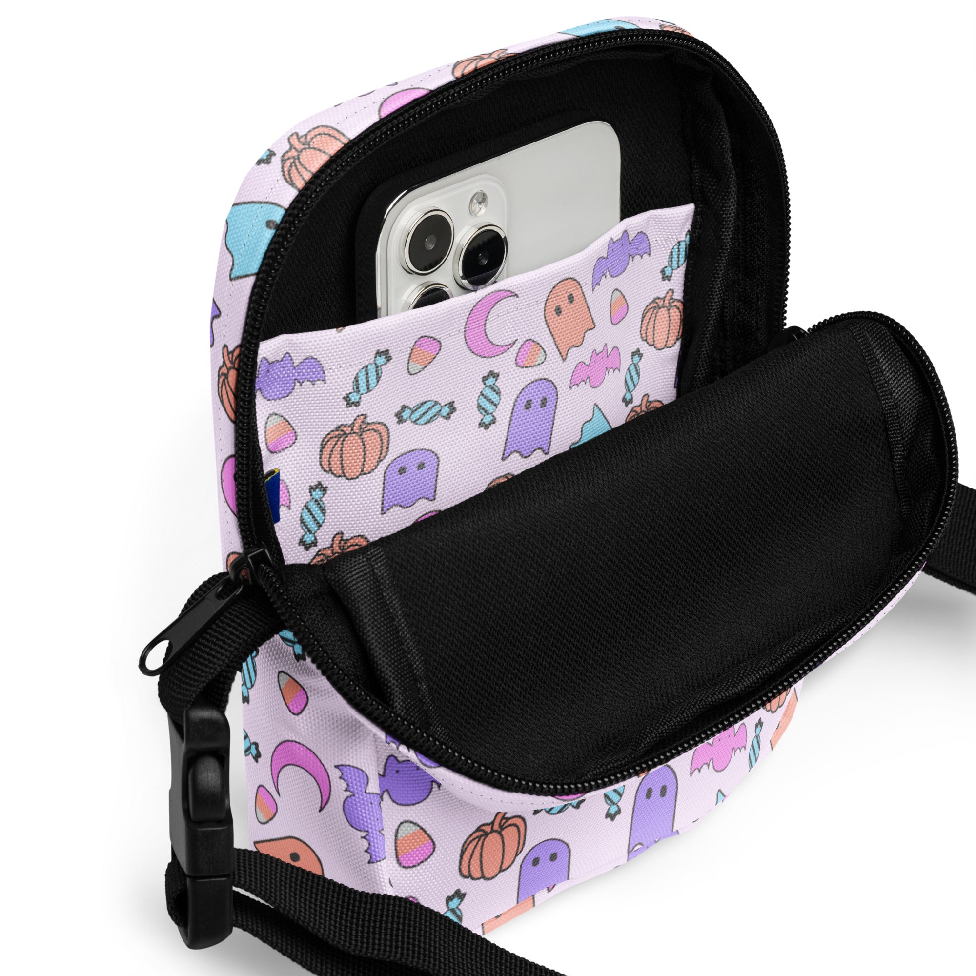 Girls ghost halloween crossbody purse pastel lavender phone pouch with playful cartoon ghosts pumpkins bats and candy print
