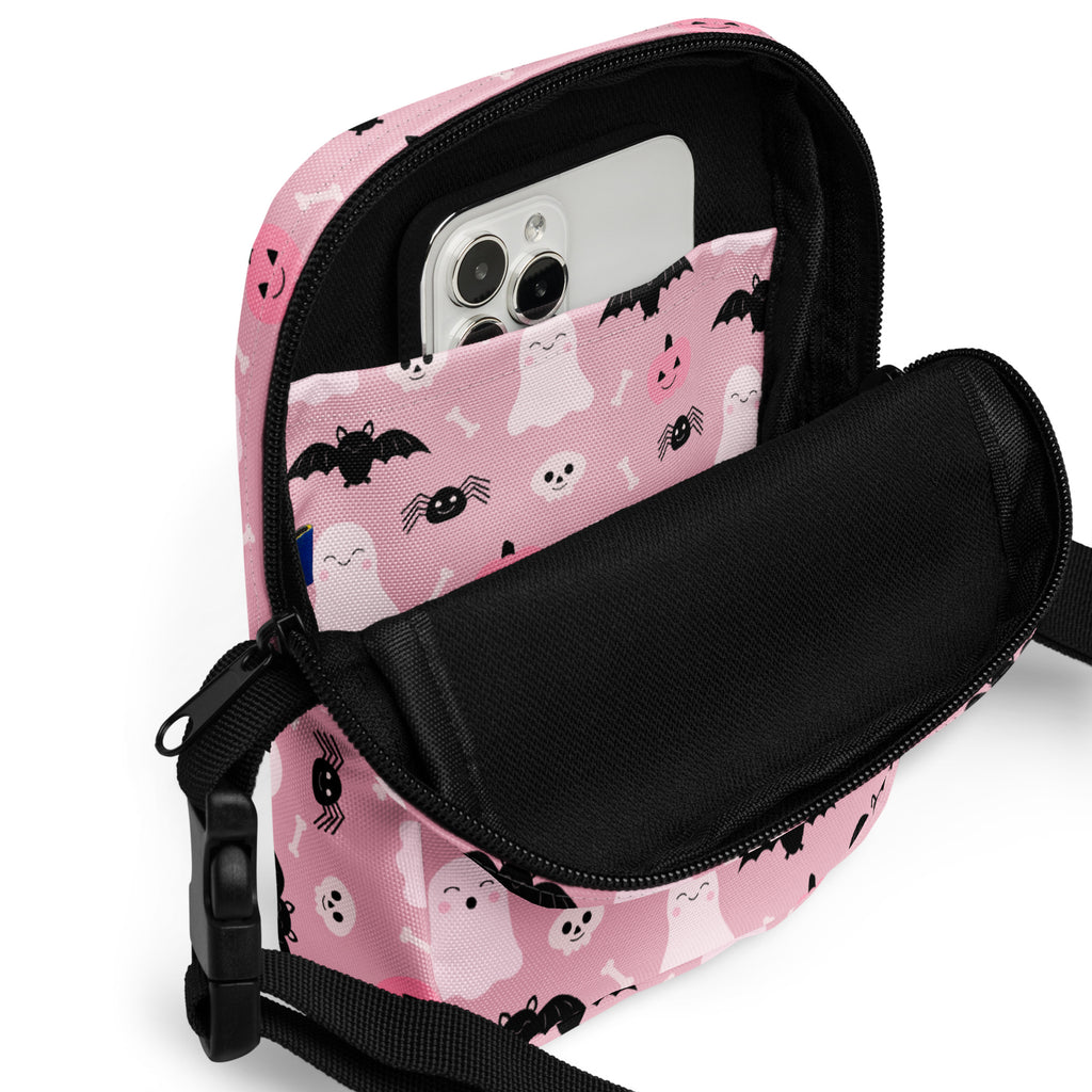 Girls cute ghost and bats pink halloween crossbody purse with black bat ghost and spider print on fabric surface