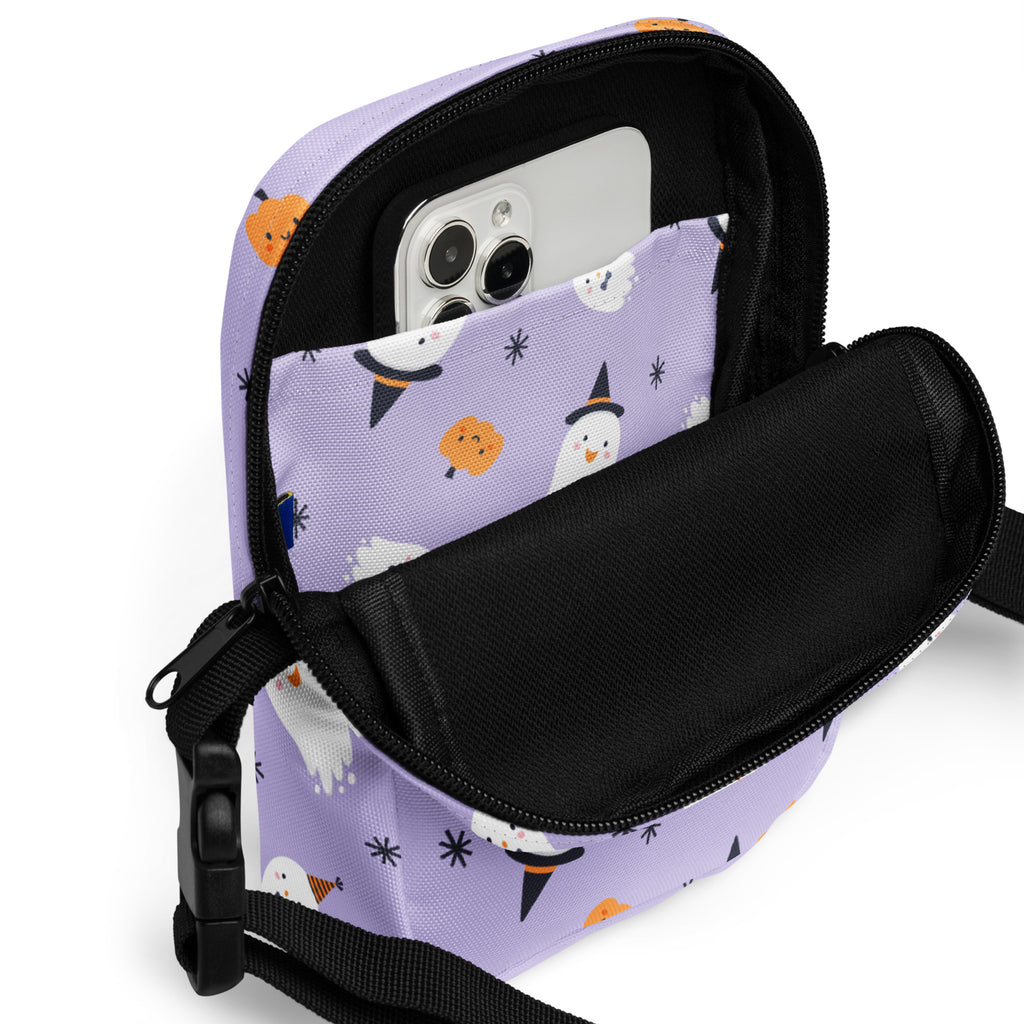 Girls ghost witch halloween crossbody purse in lavender with cute ghost and pumpkin prints, black zipper, and adjustable strap