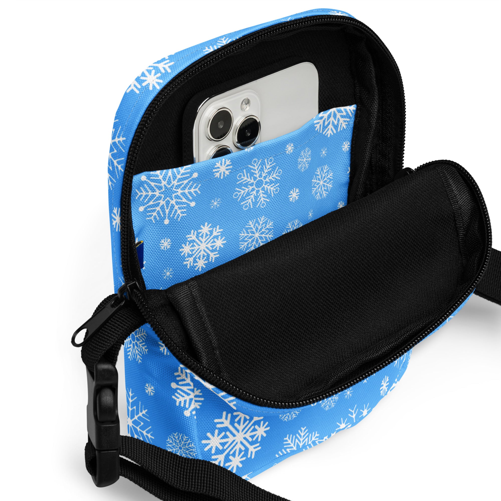 Girls blue snowflake crossbody purse with black zipper and strap featuring a snowflake-patterned phone pouch